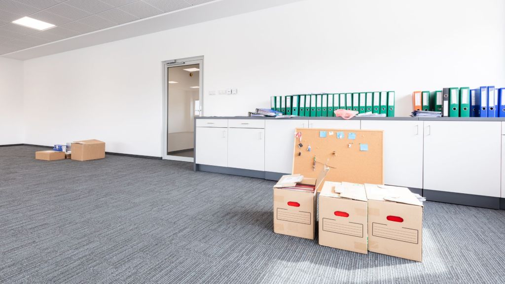 a room with boxes and a cabinet