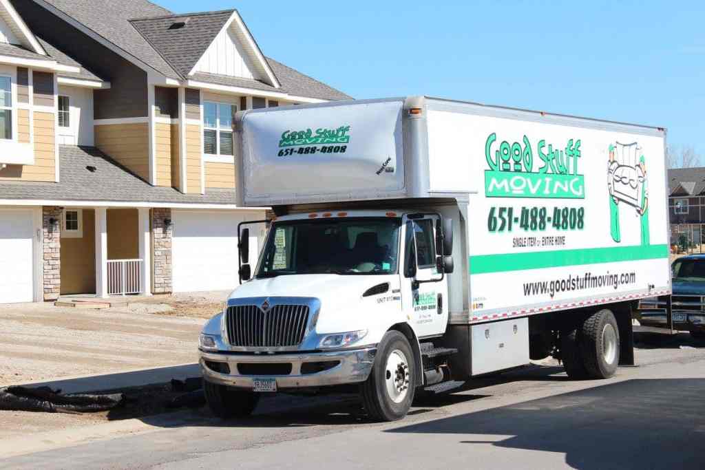 Good Stuff Moving truck parked in front of townhomes