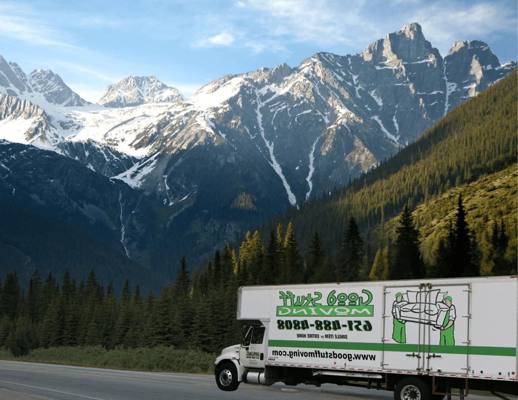 Good Stuff Moving truck driving by mountains