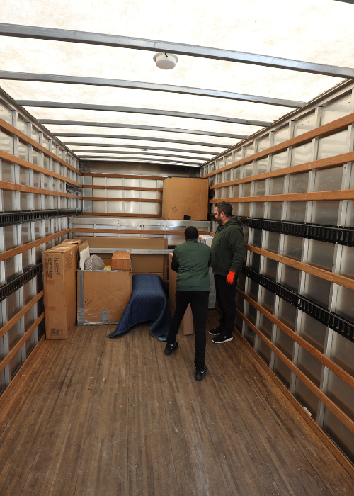 Areas We Serve 5 Team members packing up a moving truck