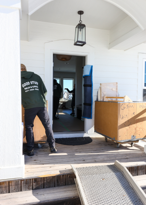 Areas We Serve 9 Good Stuff moving team members lifting boxes into house