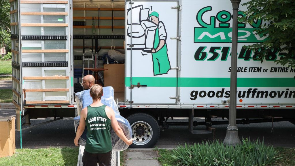 good stuff team members lifting furniture into a moving truck
