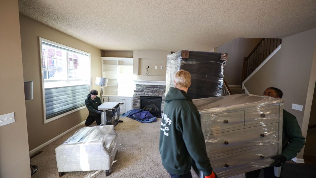 good stuff team members moving furniture out of a house