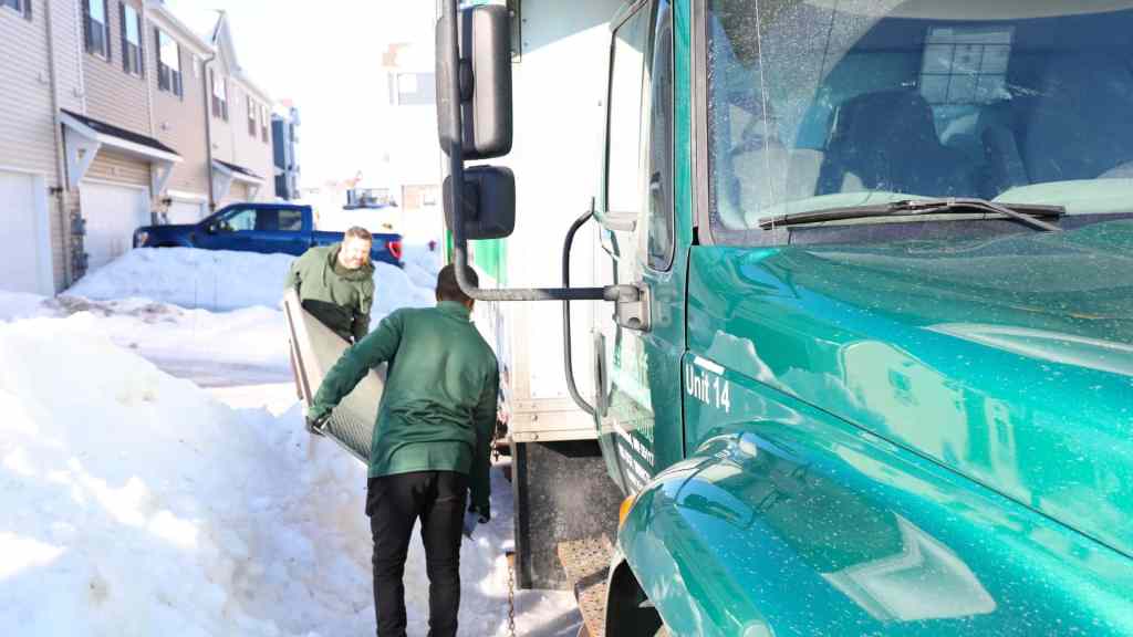 Two good stuff team members preparing a moving truck