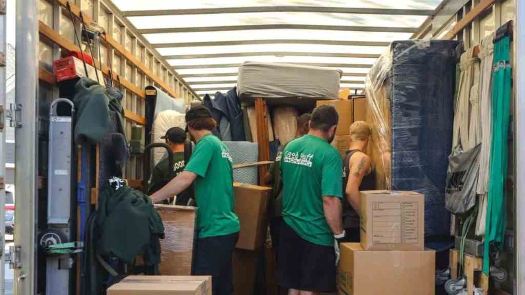 a group of good stuff team members unloading a moving truck
