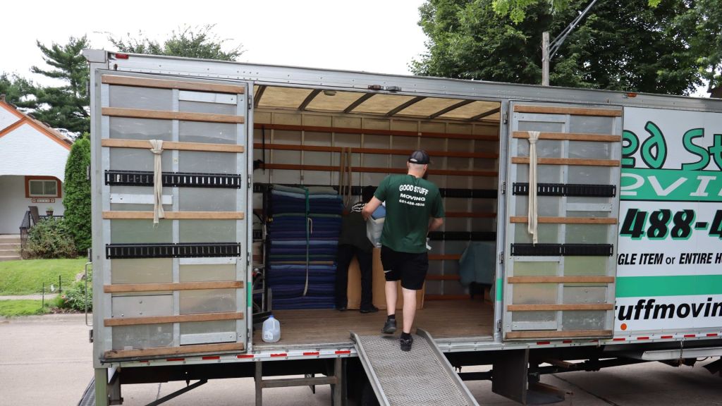 Two good stuff team members loading items into a truck