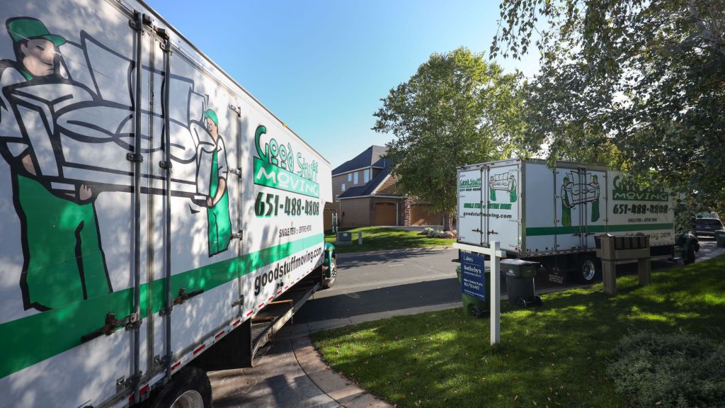 Two good stuff moving trucks parked on the street