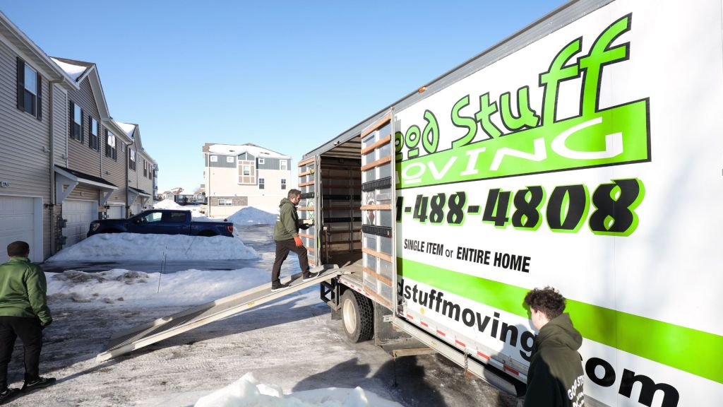Good Stuff Moving truck with an employee walking up its ramp