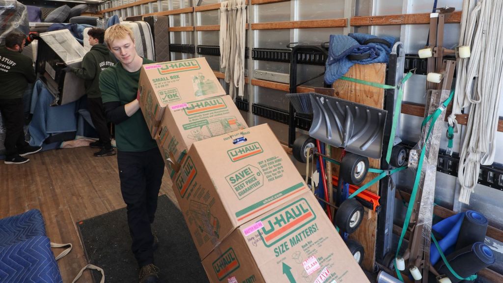 good stuff team member unloading boxes on a dolly