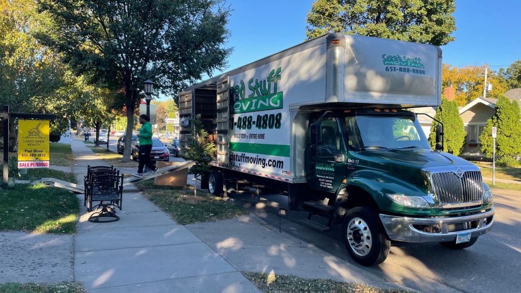 Good Stuff Moving truck parked outside of a house for sale
