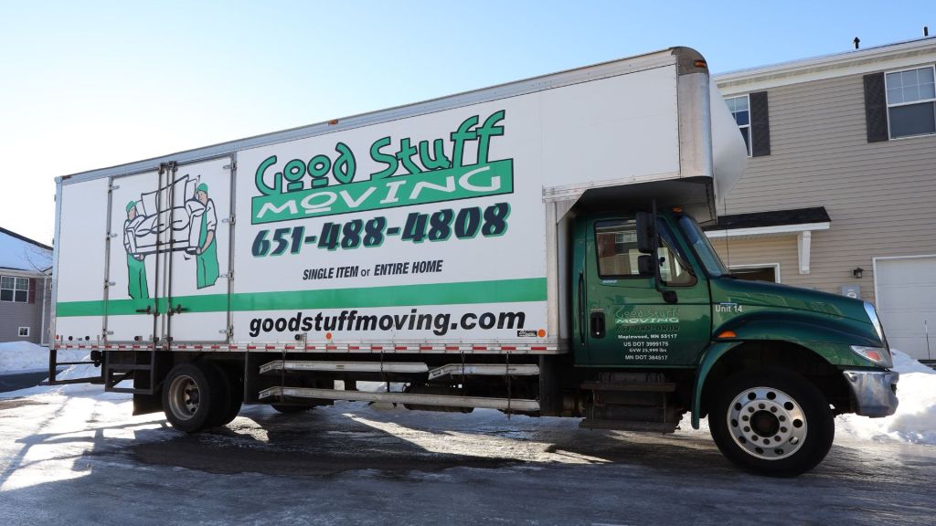 good stuff moving truck parked in front of a home