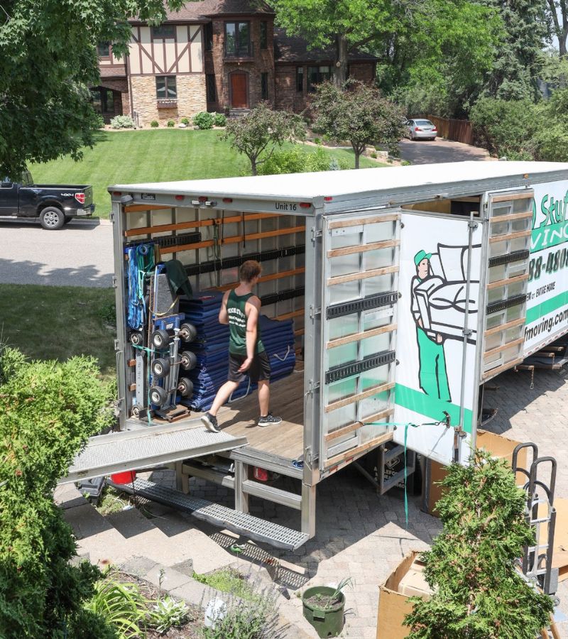 a good stuff mover walking on a ramp into the back of a moving truck