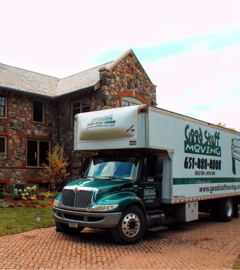 A Good Stuff Moving truck parked outside a house