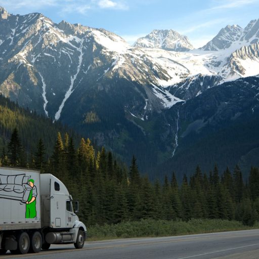 a GSM truck on the road with mountains in the background