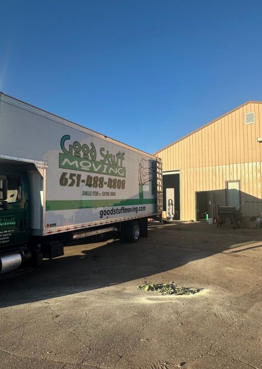 Good Stuff Moving truck backed up to a commercial building